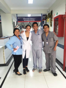 Leslie Peralta poses with Guatemalan doctors and a nurse.